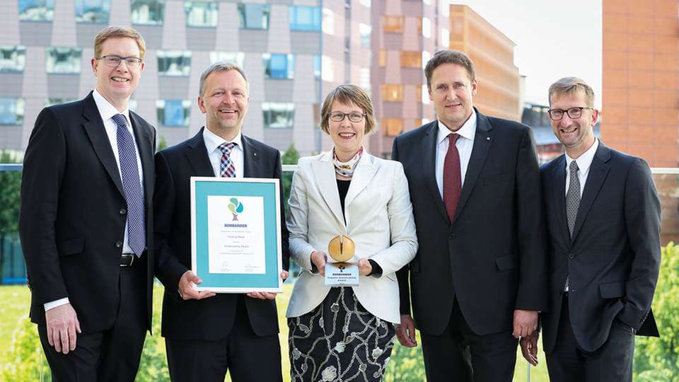 Nicht nur Charles O'Donnell von Bombardier (l.) und Andreas Mehringer von Harting (2. v. l.) freuten sich.