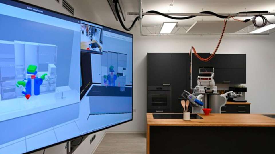 Ein Roboter als Helfer in der Küche: Szene aus dem neuen Robotik-Labor der Universität Bremen.