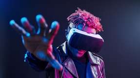 Virtual reality experience. Futuristic neon lighting. Young african american man in the studio