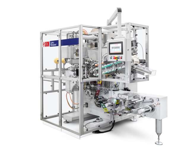   Die Wickelmaschine H-SM (Hybrid Sweet Magic) verpackt Schokoladenhohlkörper mit Aufhängfaden. 